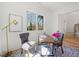 Bright office with a large window, desk, two chairs, artwork, rug, and views of the yard at 2860 3Rd Sw Ave, Atlanta, GA 30315