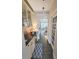 Bright butler's pantry features wine cooler, granite countertops, custom cabinets, and a door to kitchen at 3099 Dickson Ne St, Brookhaven, GA 30319