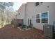 Backyard patio with grill and table and chairs at 6338 Kinsland Ct, Lithonia, GA 30058