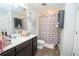 Bathroom with a wood floor, nice shower and vanity with white basin style sink at 6338 Kinsland Ct, Lithonia, GA 30058