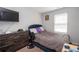 Bedroom with bed, nightstand and television at 6338 Kinsland Ct, Lithonia, GA 30058