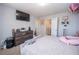 Bright bedroom with neutral walls, a double bed, and multiple doors for easy access at 6338 Kinsland Ct, Lithonia, GA 30058