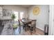 Cozy dining area adjacent to the living room, featuring a wooden table and comfortable chairs at 6338 Kinsland Ct, Lithonia, GA 30058