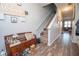 Inviting entryway with wood floors and staircase leading to the upper level at 6338 Kinsland Ct, Lithonia, GA 30058