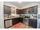 Modern kitchen with stainless steel appliances, granite counters, and ample cabinet space at 6338 Kinsland Ct, Lithonia, GA 30058