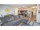 Cozy living area adjacent to modern kitchen with stainless steel appliances at 6338 Kinsland Ct, Lithonia, GA 30058