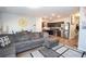 Open-concept living area with kitchen featuring stainless steel appliances at 6338 Kinsland Ct, Lithonia, GA 30058