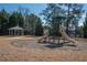 Community playground featuring slides, climbing structure, and a cozy covered picnic area at 6338 Kinsland Ct, Lithonia, GA 30058