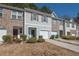 Attractive townhome with a one-car garage and well-maintained front yard at 6338 Kinsland Ct, Lithonia, GA 30058
