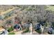 Aerial view of home with large lot outlined in black, surrounded by trees at 4460 Wimberly Way, Cumming, GA 30028