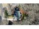 Aerial of the home with driveway, deck, shed, and mature trees at 4460 Wimberly Way, Cumming, GA 30028