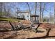 Scenic backyard featuring a firepit, gazebo, and deck, ideal for outdoor entertaining and relaxation at 4460 Wimberly Way, Cumming, GA 30028