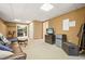 Cozy basement featuring comfortable seating, a television, and a convenient mini-fridge at 4460 Wimberly Way, Cumming, GA 30028