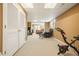 Finished basement featuring neutral carpeting, exercise bike, seating, and a storage closet at 4460 Wimberly Way, Cumming, GA 30028