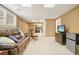 Cozy finished basement with a leather sofa, television, and functional mini fridge at 4460 Wimberly Way, Cumming, GA 30028