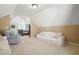 Spacious bonus room featuring comfortable seating and seamless access to the main bedroom at 4460 Wimberly Way, Cumming, GA 30028