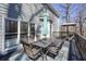 Spacious wooden deck with outdoor dining set and closed umbrella, next to light-gray home at 4460 Wimberly Way, Cumming, GA 30028