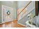 Bright foyer with hardwood floors, staircase, and a beautiful entryway, perfect for guests at 4460 Wimberly Way, Cumming, GA 30028