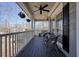 Relaxing front porch with comfortable seating, hanging plants, and ample space for outdoor enjoyment at 4460 Wimberly Way, Cumming, GA 30028