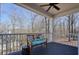 Inviting covered porch featuring cozy bench seating, perfect for enjoying the outdoors at 4460 Wimberly Way, Cumming, GA 30028