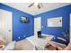 Home office with blue walls, a white desk, and a view of the backyard at 4460 Wimberly Way, Cumming, GA 30028