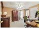 Home office featuring classic wood furniture, neutral carpet, ceiling fan, and ample lighting at 4460 Wimberly Way, Cumming, GA 30028