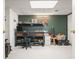 A functional workshop space with pegboard, workbench, organized storage, and ample lighting at 4460 Wimberly Way, Cumming, GA 30028