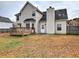 Expansive backyard showcasing the home's exterior, a wooden deck, and an inviting outdoor space surrounded by trees at 4871 Ship Jack Ln, Decatur, GA 30035