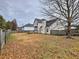 Spacious backyard with a wooden deck, mature trees, and privacy fencing, offering a serene and private outdoor space at 4871 Ship Jack Ln, Decatur, GA 30035