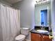 Cozy bathroom featuring a shower-tub combination, a vanity with a black countertop and updated fixtures, and neutral paint at 4871 Ship Jack Ln, Decatur, GA 30035