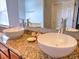 Dual sink vanity with granite countertop and vessel sinks in a bathroom at 4871 Ship Jack Ln, Decatur, GA 30035
