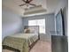 Bedroom featuring a tray ceiling and neutral carpeting at 4871 Ship Jack Ln, Decatur, GA 30035