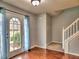 Entryway with door featuring sidelights, hardwood floors, and a view of staircase at 4871 Ship Jack Ln, Decatur, GA 30035
