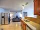 Kitchen with stainless steel appliances and granite countertops opening to the living room at 4871 Ship Jack Ln, Decatur, GA 30035