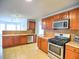 Kitchen featuring tile floors, granite counters, stainless steel appliances, and lots of cabinets at 4871 Ship Jack Ln, Decatur, GA 30035