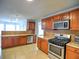 Kitchen featuring tile floors, granite counters, stainless steel appliances, and lots of cabinets at 4871 Ship Jack Ln, Decatur, GA 30035