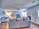 Comfortable living room with neutral tones, featuring a fireplace, plush sofas, and hardwood floors at 4871 Ship Jack Ln, Decatur, GA 30035
