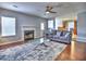 Spacious living room featuring a cozy fireplace, hardwood floors, and comfortable furniture at 4871 Ship Jack Ln, Decatur, GA 30035