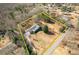 An aerial shot of a home and property with a yellow outline in a wooded area at 6365 Mountain View Trl, Cumming, GA 30041