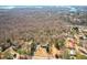 Aerial view of the home nestled among trees and close to Lake Lanier at 6365 Mountain View Trl, Cumming, GA 30041