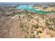 An aerial view shows a lake community, with the home situated among dense trees at 6365 Mountain View Trl, Cumming, GA 30041