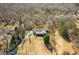 Aerial view of the home with mature trees around the property at 6365 Mountain View Trl, Cumming, GA 30041