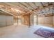 Unfinished basement offering potential for customization, with exposed ceiling and concrete walls at 6365 Mountain View Trl, Cumming, GA 30041