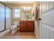 Well-lit bathroom featuring a shower, window and a vanity at 6365 Mountain View Trl, Cumming, GA 30041