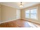Cozy bedroom featuring hardwood floors, natural light, and neutral decor at 6365 Mountain View Trl, Cumming, GA 30041