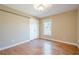 This bedroom boasts hardwood floors, neutral paint, and a well-sized closet at 6365 Mountain View Trl, Cumming, GA 30041