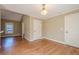 Open dining area boasts hardwood floors, natural light, and access to other rooms at 6365 Mountain View Trl, Cumming, GA 30041