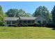 Charming ranch-style home with a welcoming front porch and well-maintained landscaping at 6365 Mountain View Trl, Cumming, GA 30041