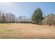 Beautiful single-story home with a well-manicured lawn and inviting front porch at 6365 Mountain View Trl, Cumming, GA 30041