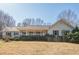 Charming single-story home with a welcoming front porch and lush landscaping at 6365 Mountain View Trl, Cumming, GA 30041